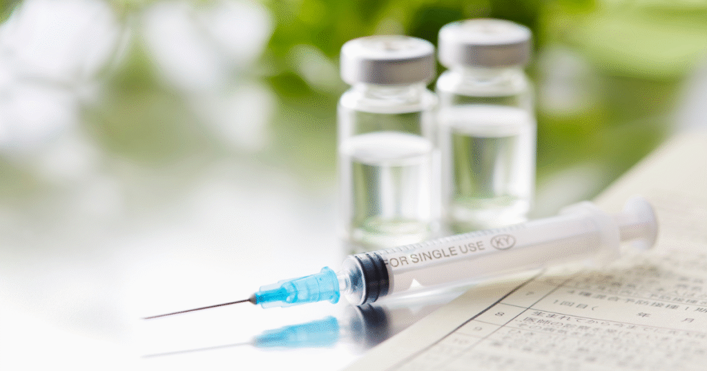 Medical vials and syringe illustrating peptide therapy ingredients like GHK-Cu, TB-500, and BPC-157