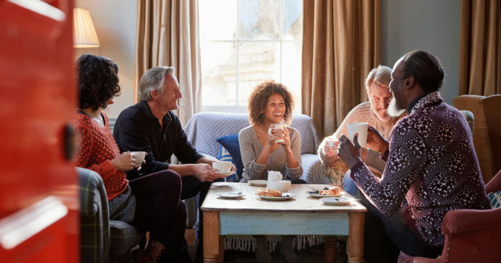 Group of diverse adults enjoying conversation, representing who benefits from Glow Stack Peptide therapy.